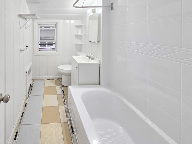 full bath with toilet, radiator, a bathing tub, tile patterned floors, and vanity