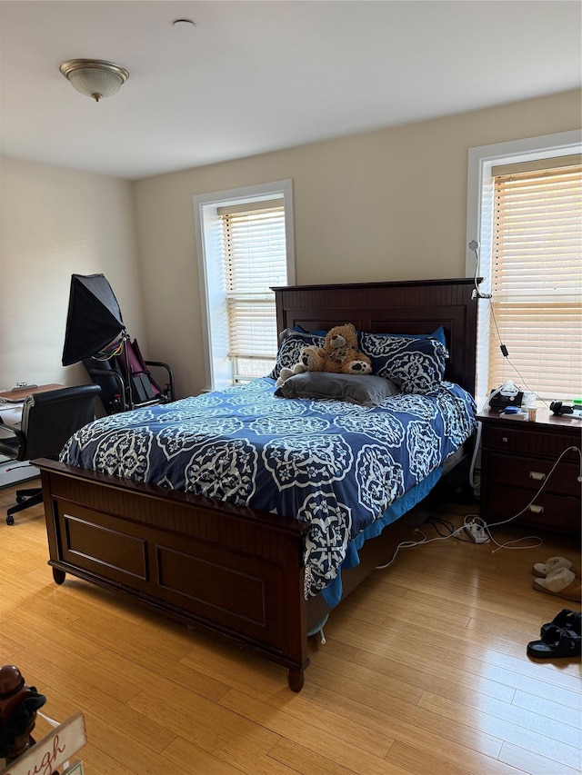 bedroom with light wood finished floors