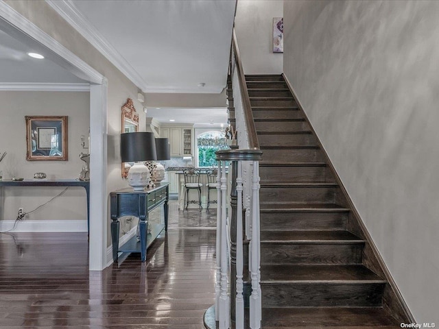 stairs featuring ornamental molding, recessed lighting, baseboards, and wood finished floors