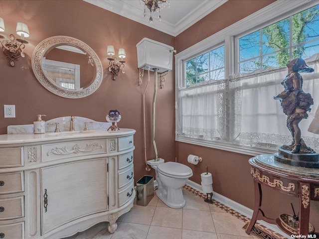 half bath with baseboards, toilet, tile patterned floors, crown molding, and vanity