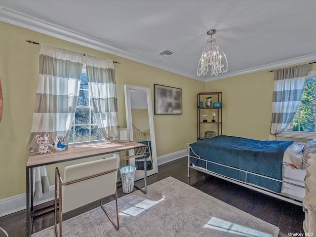 bedroom with a notable chandelier, crown molding, and wood finished floors