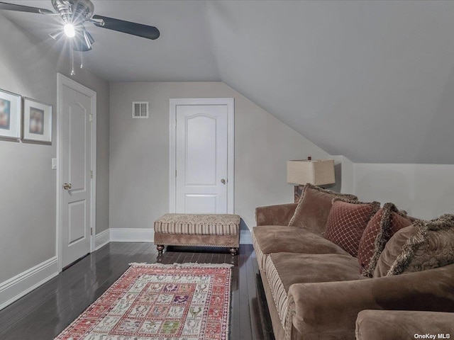 living area with baseboards, visible vents, a ceiling fan, lofted ceiling, and dark wood-style flooring