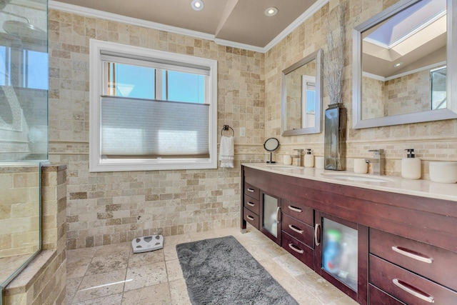 bathroom featuring crown molding, double vanity, recessed lighting, backsplash, and a sink