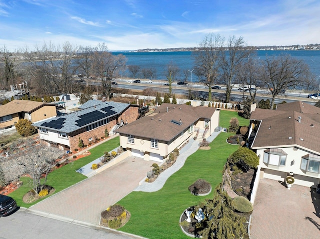 bird's eye view with a water view and a residential view