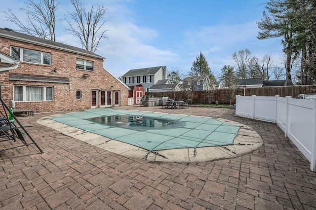 view of pool featuring a patio area, a fenced in pool, and a fenced backyard