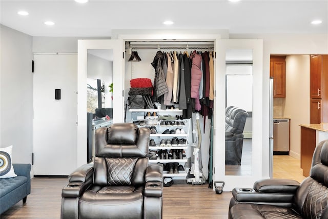 interior space with light wood finished floors and recessed lighting