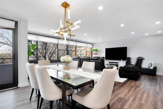 dining area with recessed lighting, plenty of natural light, wood finished floors, and a notable chandelier