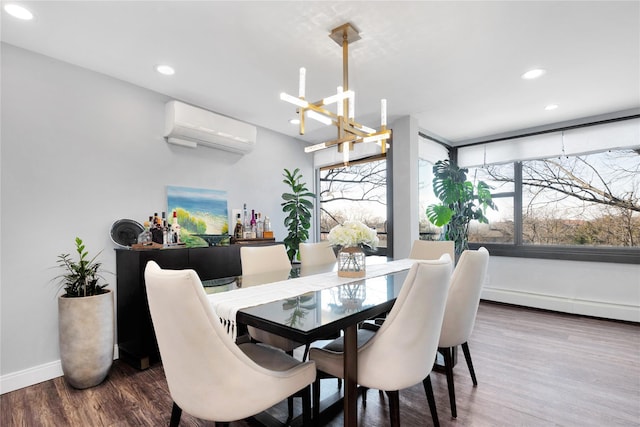 dining area featuring recessed lighting, a wall mounted AC, wood finished floors, a chandelier, and baseboards