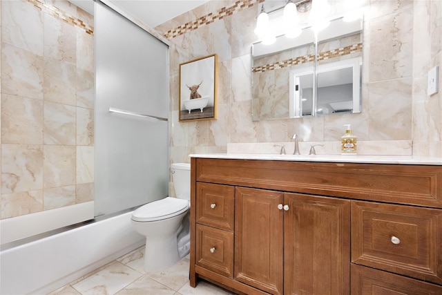 full bath with enclosed tub / shower combo, toilet, vanity, tile walls, and marble finish floor