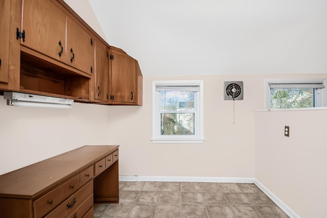 washroom featuring a healthy amount of sunlight and baseboards