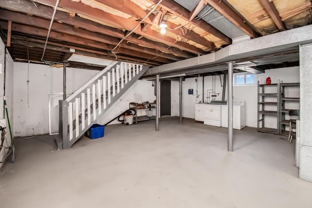 basement featuring stairway and independent washer and dryer