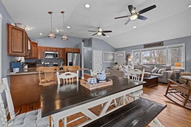 dining space featuring lofted ceiling, ceiling fan, recessed lighting, and light wood-style floors