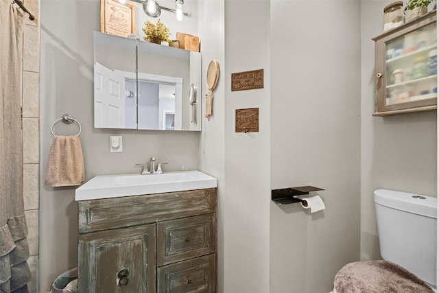 bathroom with vanity and toilet