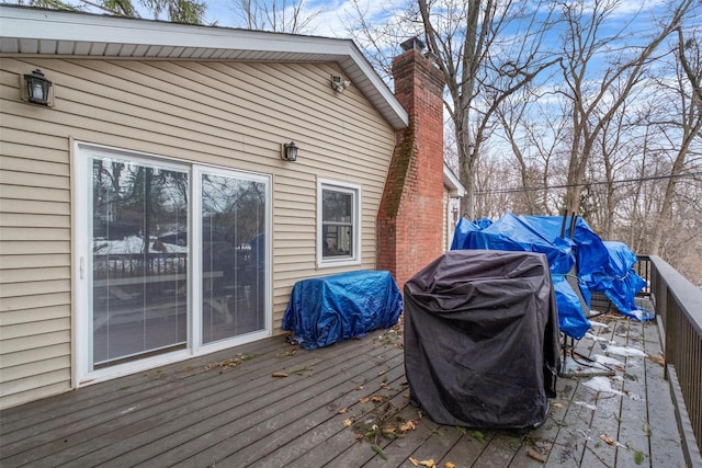 wooden terrace featuring grilling area