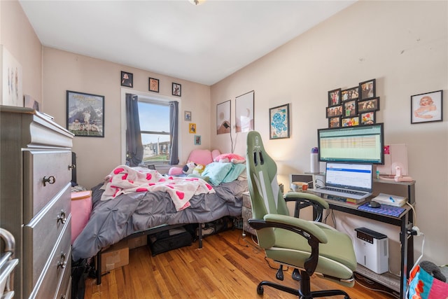 bedroom featuring wood finished floors