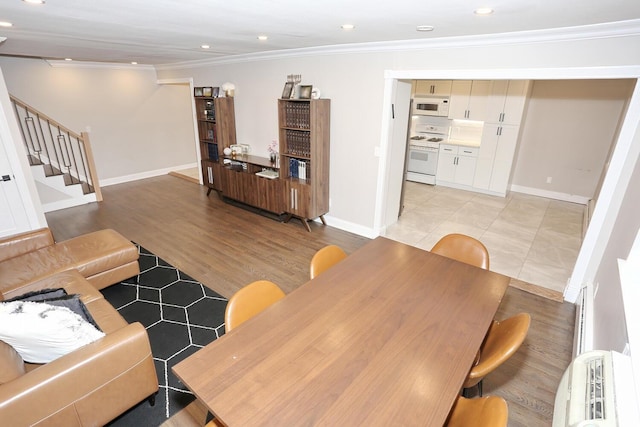 living area featuring recessed lighting, stairway, ornamental molding, light wood-type flooring, and baseboards