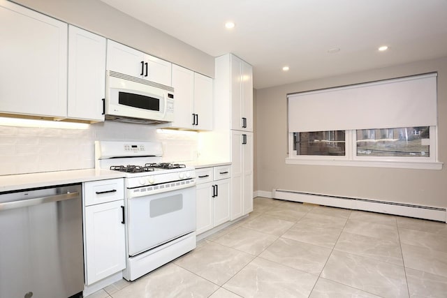 kitchen featuring tasteful backsplash, light countertops, baseboard heating, white cabinetry, and white appliances