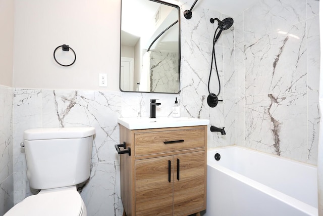 full bathroom featuring shower / bathtub combination, toilet, vanity, and tile walls