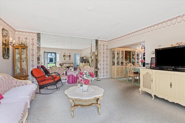 living area with wallpapered walls, carpet, ornamental molding, and a notable chandelier