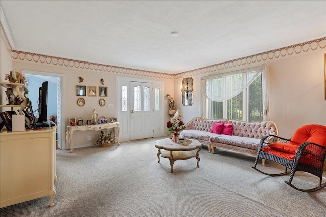 living area with a wealth of natural light, crown molding, baseboards, and carpet flooring