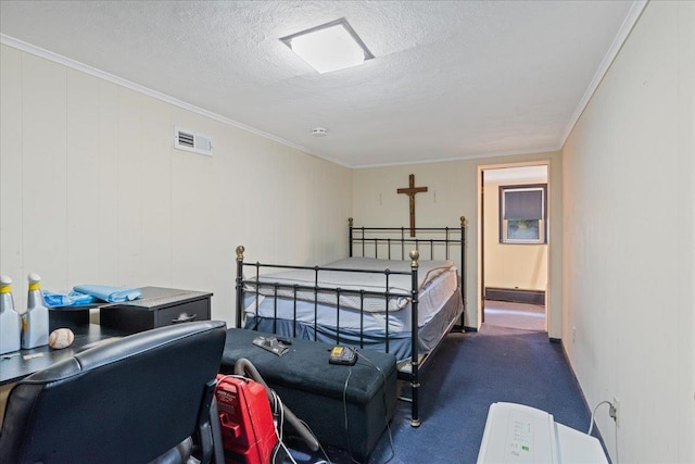 carpeted bedroom featuring crown molding, visible vents, and a textured ceiling