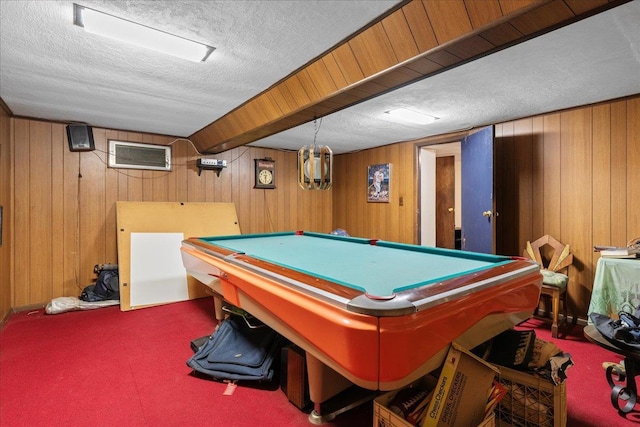 game room with wood walls, a textured ceiling, carpet flooring, and pool table