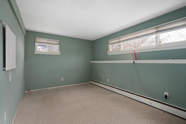 spare room with baseboards and baseboard heating