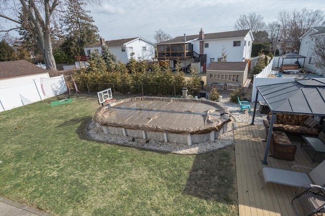 view of yard featuring a patio area, a fenced backyard, and a residential view