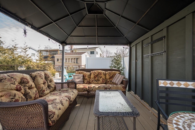 wooden terrace with an outdoor hangout area