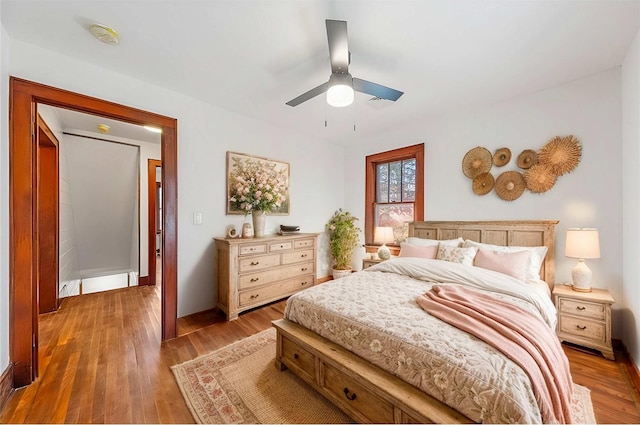 bedroom featuring wood finished floors and a ceiling fan