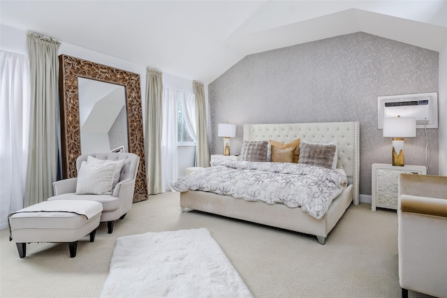 bedroom with light carpet, vaulted ceiling, and a wall mounted AC