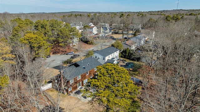 aerial view with a residential view and a wooded view