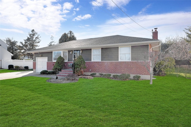 single story home featuring driveway, an attached garage, a chimney, and a front yard