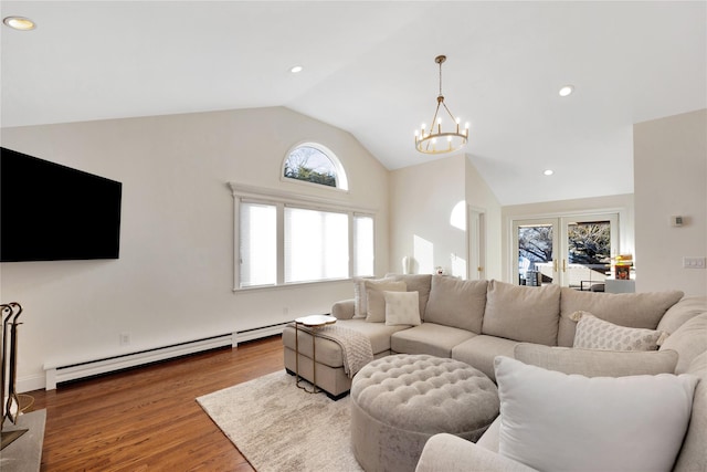 living room with a chandelier, lofted ceiling, wood finished floors, a baseboard heating unit, and recessed lighting