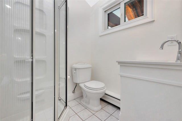 full bath featuring a stall shower, toilet, a baseboard radiator, tile patterned floors, and a sink