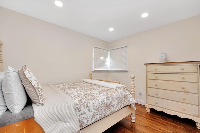 bedroom with recessed lighting, baseboards, and wood finished floors