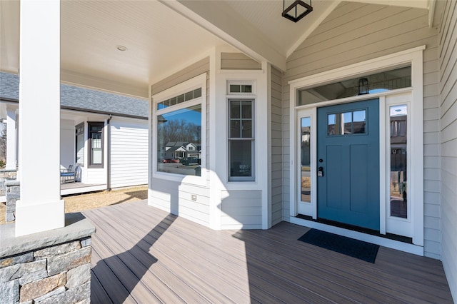 doorway to property featuring covered porch