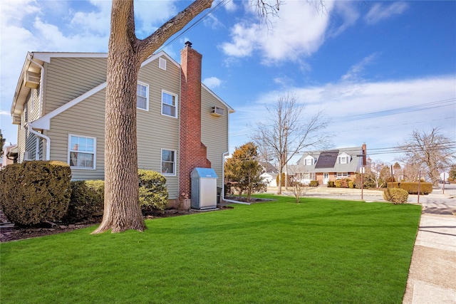 view of side of property featuring a yard