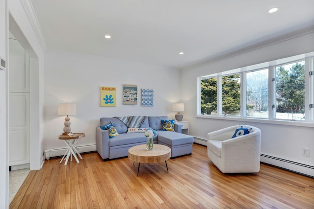 living room with recessed lighting, light wood-style flooring, baseboard heating, and ornamental molding