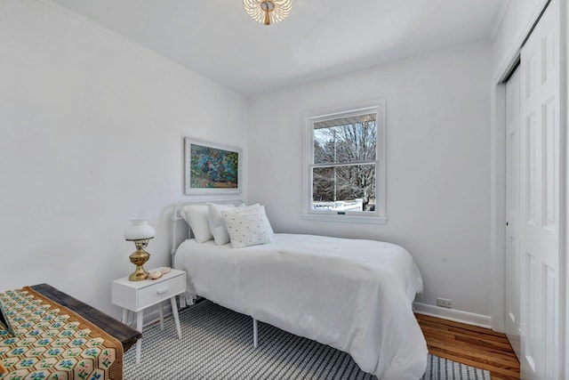 4645 Rocky Point Rd, East Marion, NY 11939 - bedroom with a closet, baseboards, and wood finished floors