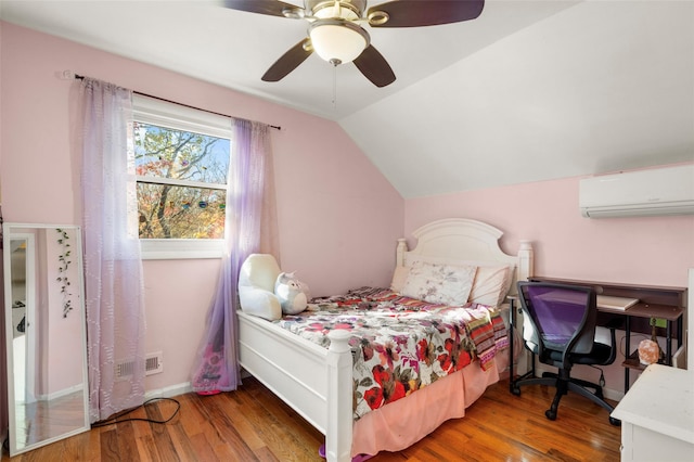 bedroom with baseboards, a ceiling fan, wood finished floors, vaulted ceiling, and a wall mounted AC