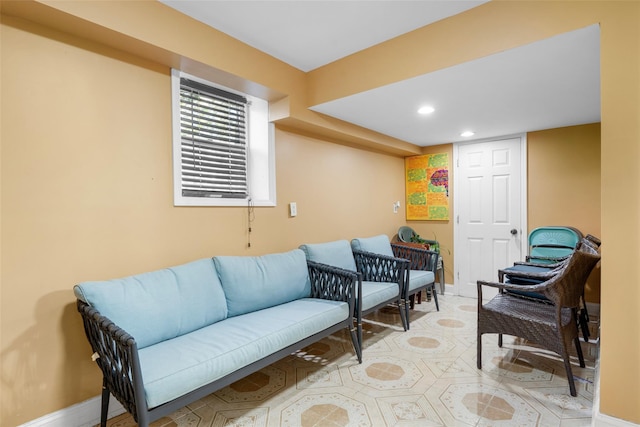 living area featuring recessed lighting and baseboards