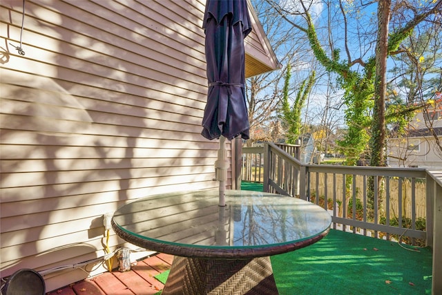 wooden deck featuring outdoor dining space