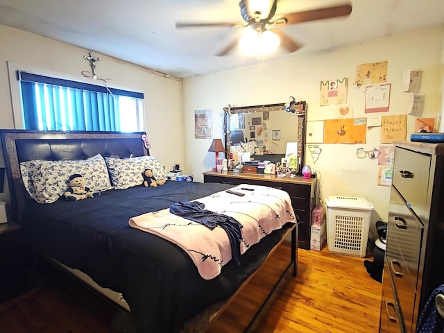 bedroom with ceiling fan and wood finished floors