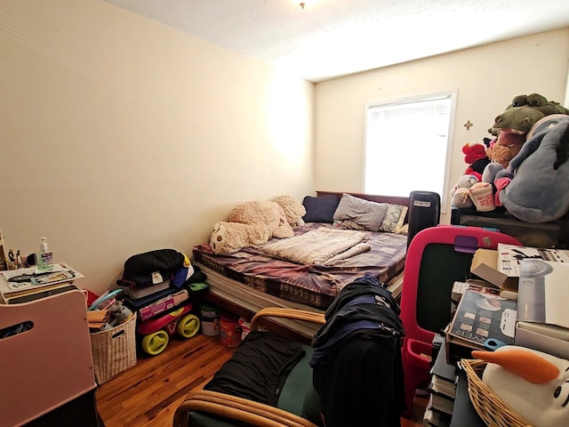 bedroom with wood finished floors