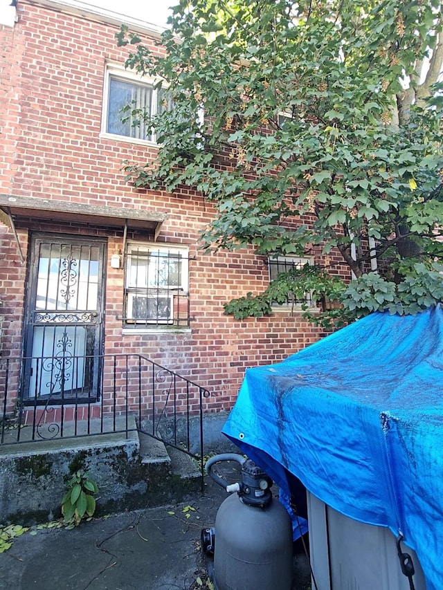 view of property exterior featuring brick siding