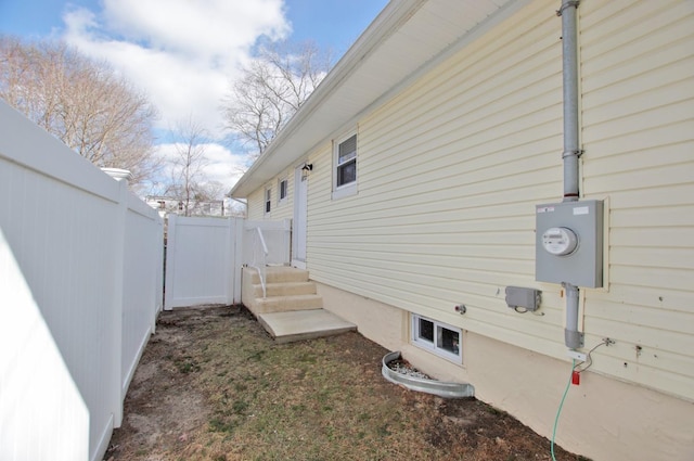 view of side of property with a fenced backyard