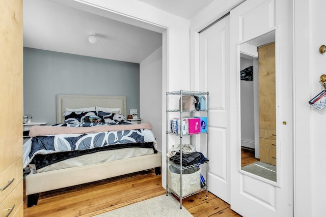 bedroom with wood finished floors