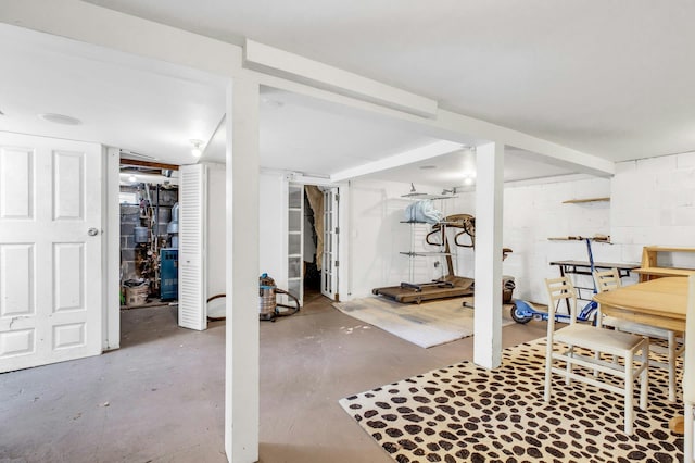 finished basement featuring concrete block wall