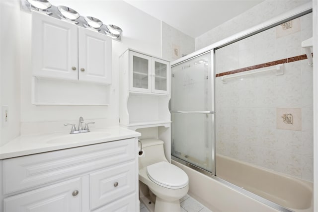 full bath featuring bath / shower combo with glass door, vanity, and toilet